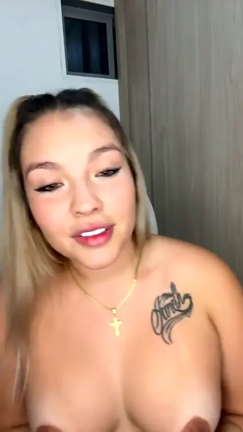 Fabiana Rios, a sensational blonde with tattoos, taking off her dress