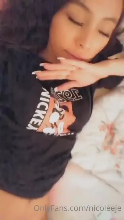 Nicole Daniela, the naughty muse, showing off lying down