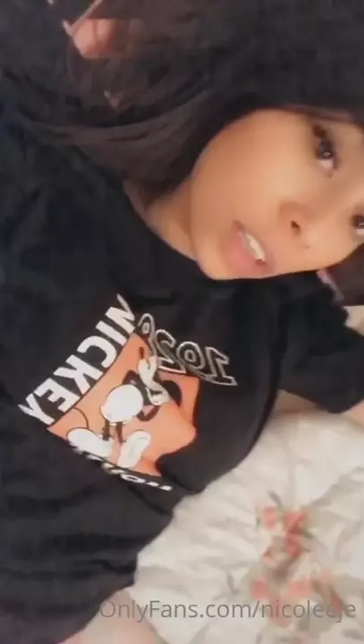 Nicole Daniela, the naughty muse, showing off lying down